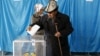 Kazakhstabn -- People vote during a snap parliamentary election in a village of Toretam, southern Kazakhstan, March 20, 2016