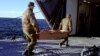 Finnish soldiers carry the coffin of a victim from the passenger ferry Estonia which sank off Finland carrying more than 1000 passengers and crew from the Estonian capital Tallin to Stockholm early September 28th