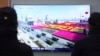 SOUTH KOREA -- People watch a TV showing North Korea's missiles during a military parade in Pyongyang, North Korea, at Seoul Railway Station in Seoul, February 8, 2018