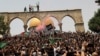 ISRAEL - Palestinians react at the compound that houses Al-Aqsa Mosque, known to Muslims as Noble Sanctuary and to Jews as Temple Mount, in Jerusalem's Old City May 21, 2021.