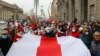 BELARUS -- Belarusian pensioners carrying a former white-red-white flag of Belarus parade through the streets during a rally to demand the resignation of authoritarian leader and new fair election, in Minsk, November 2, 2020